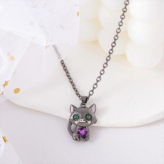 cat-shaped necklace with a purple heart pendant on a white background