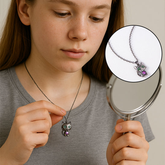girl examining a necklace with a magnifying glass, inset showing the necklace's details.