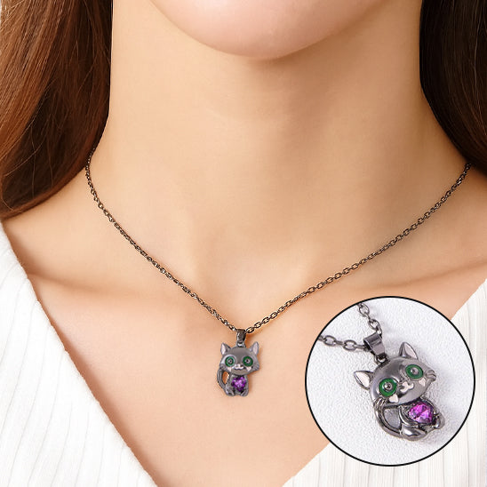 Cat-shaped necklace with a close-up inset on a mannequin.